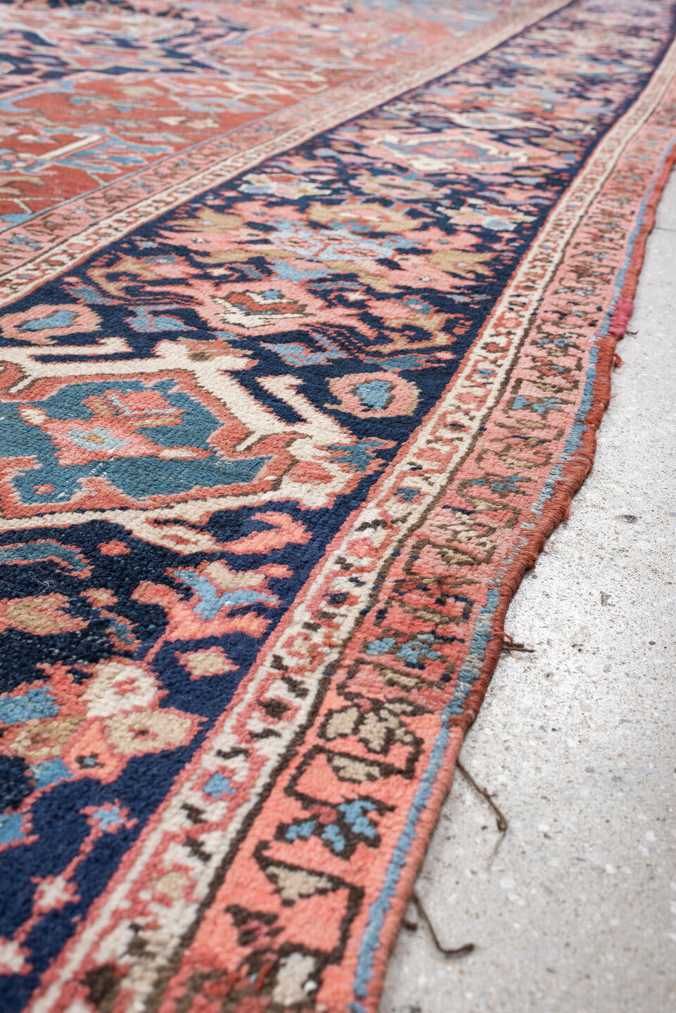 11' x 16' one-of-a-kind handmade vintage Heriz oversize rug. Color palette: terra cotta, navy, sky blue, ivory, rose, slate