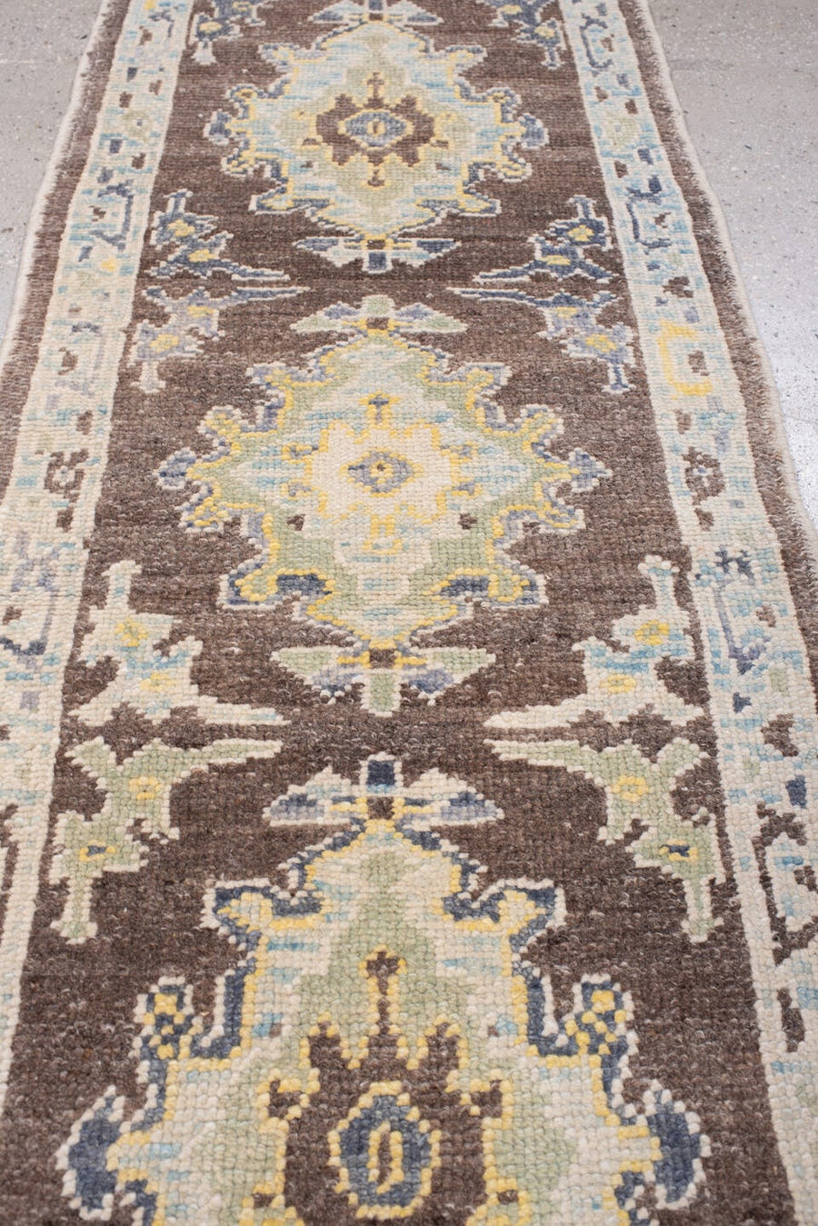 2' x 5' one-of-a-kind handmade vintage Oushak small size rug. Color palette: chocolate brown, pale aqua, ivory