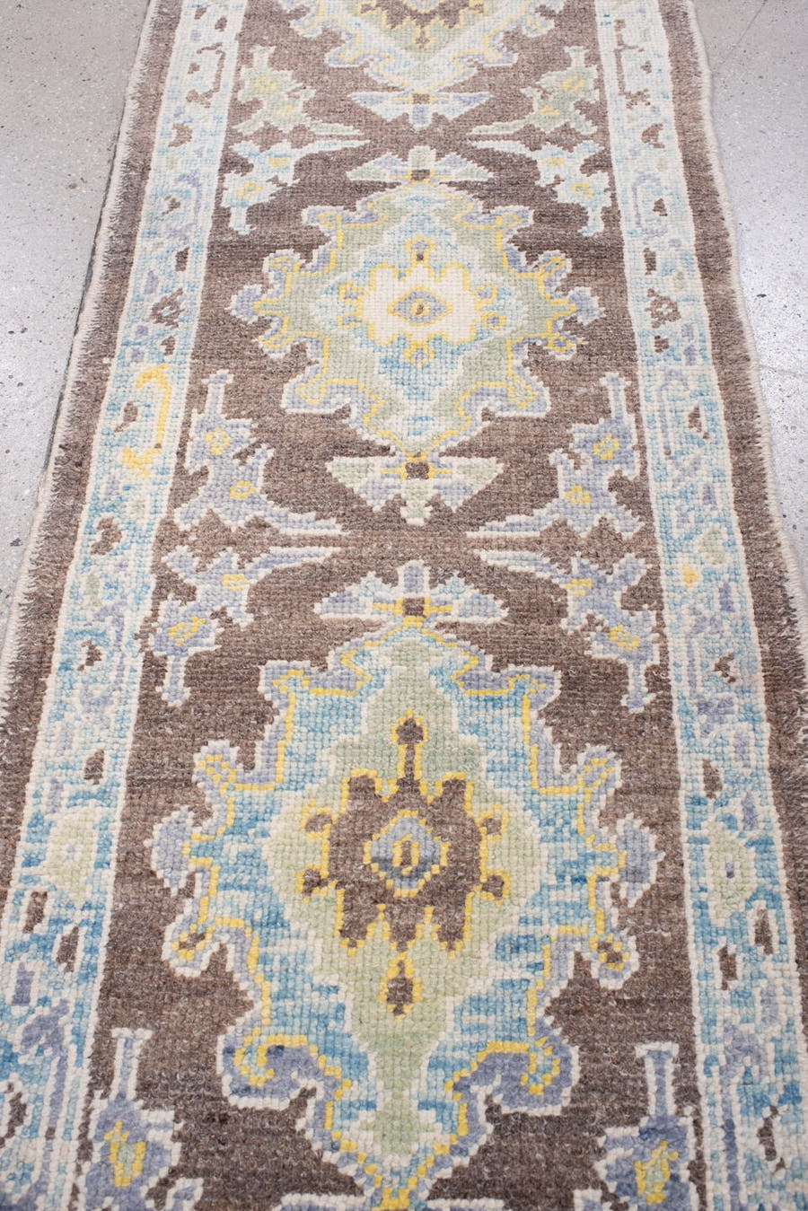 2' x 6' one-of-a-kind handmade vintage Oushak runner rug. Color palette: brown, ivory, pale blue, slate blue, muted gold