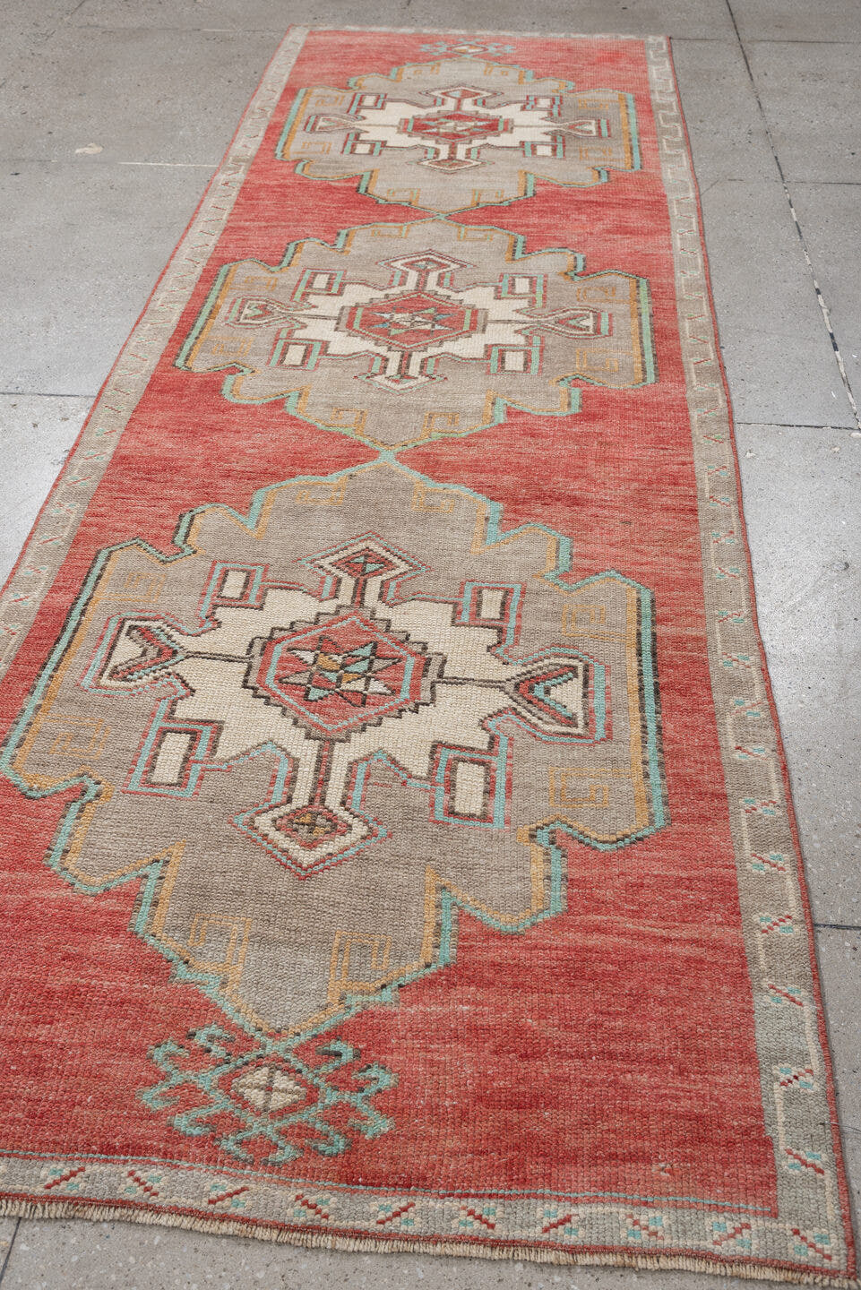 2' x 10' one-of-a-kind handmade vintage  runner rug. Color palette: terracotta, ivory, taupe, aqua, rust, sage, brown, beige