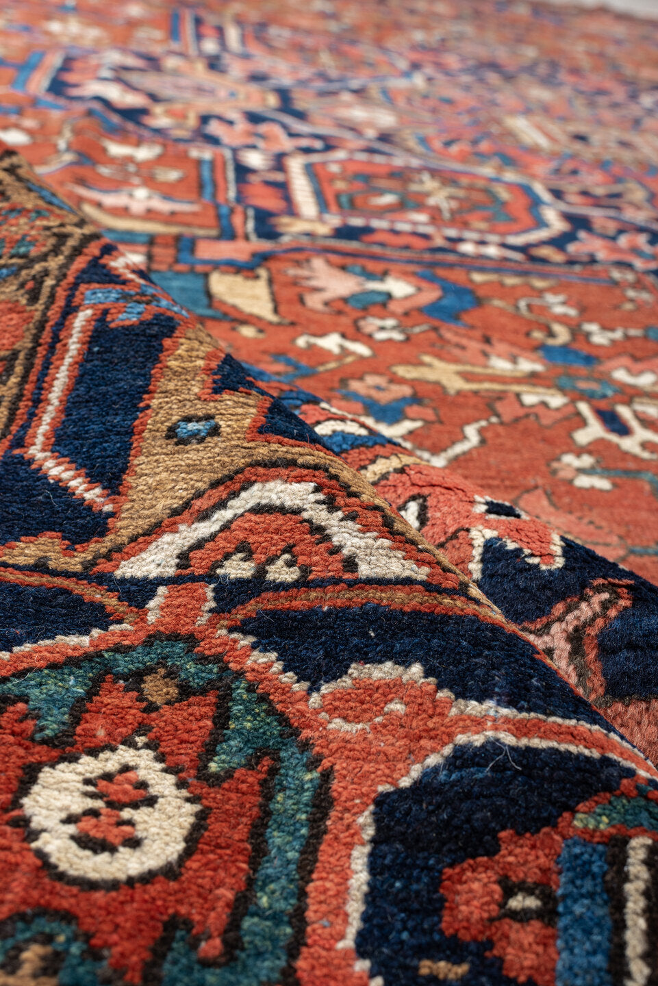 8' x 12' one-of-a-kind handmade vintage Heriz large size rug. Color palette: terracotta, navy, sky blue, ivory, camel, rust