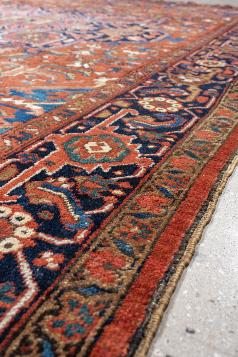 8' x 12' one-of-a-kind handmade vintage Heriz large size rug. Color palette: terracotta, navy, sky blue, ivory, camel, rust