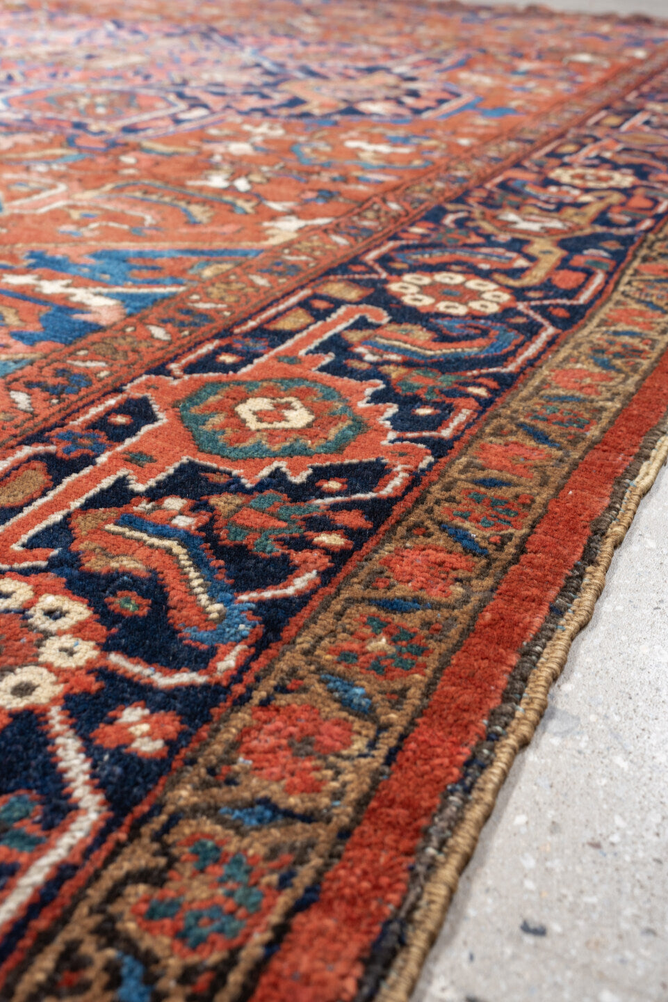 8' x 12' one-of-a-kind handmade vintage Heriz large size rug. Color palette: terracotta, navy, sky blue, ivory, camel, rust