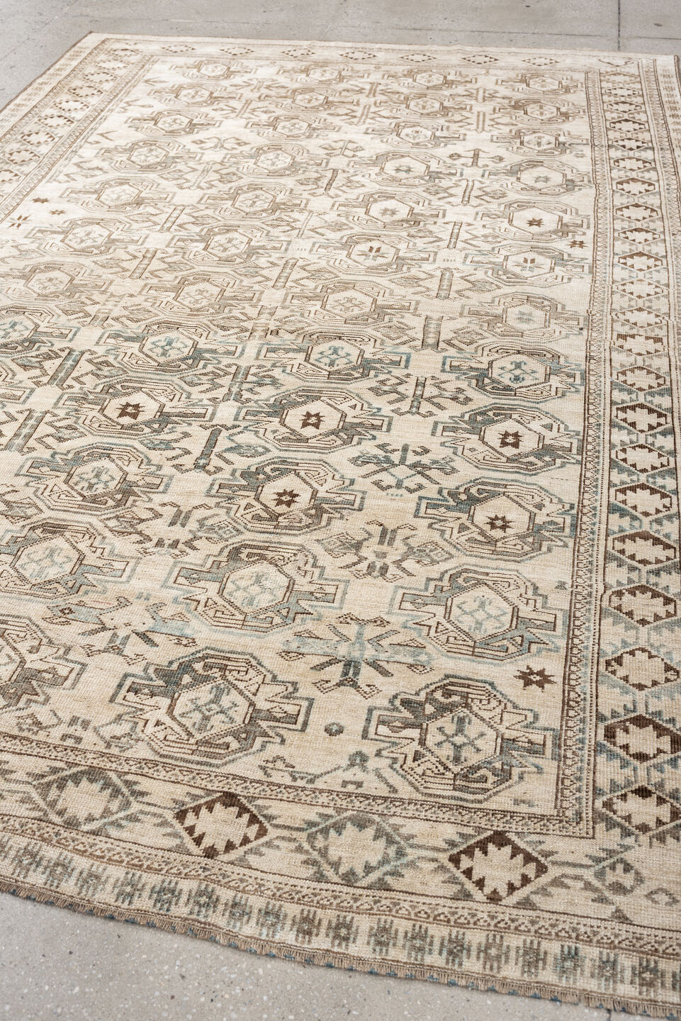 6' x 8' one-of-a-kind handmade vintage Belouch medium size rug. Color palette: ivory, taupe, brown, camel, pale blue, beige