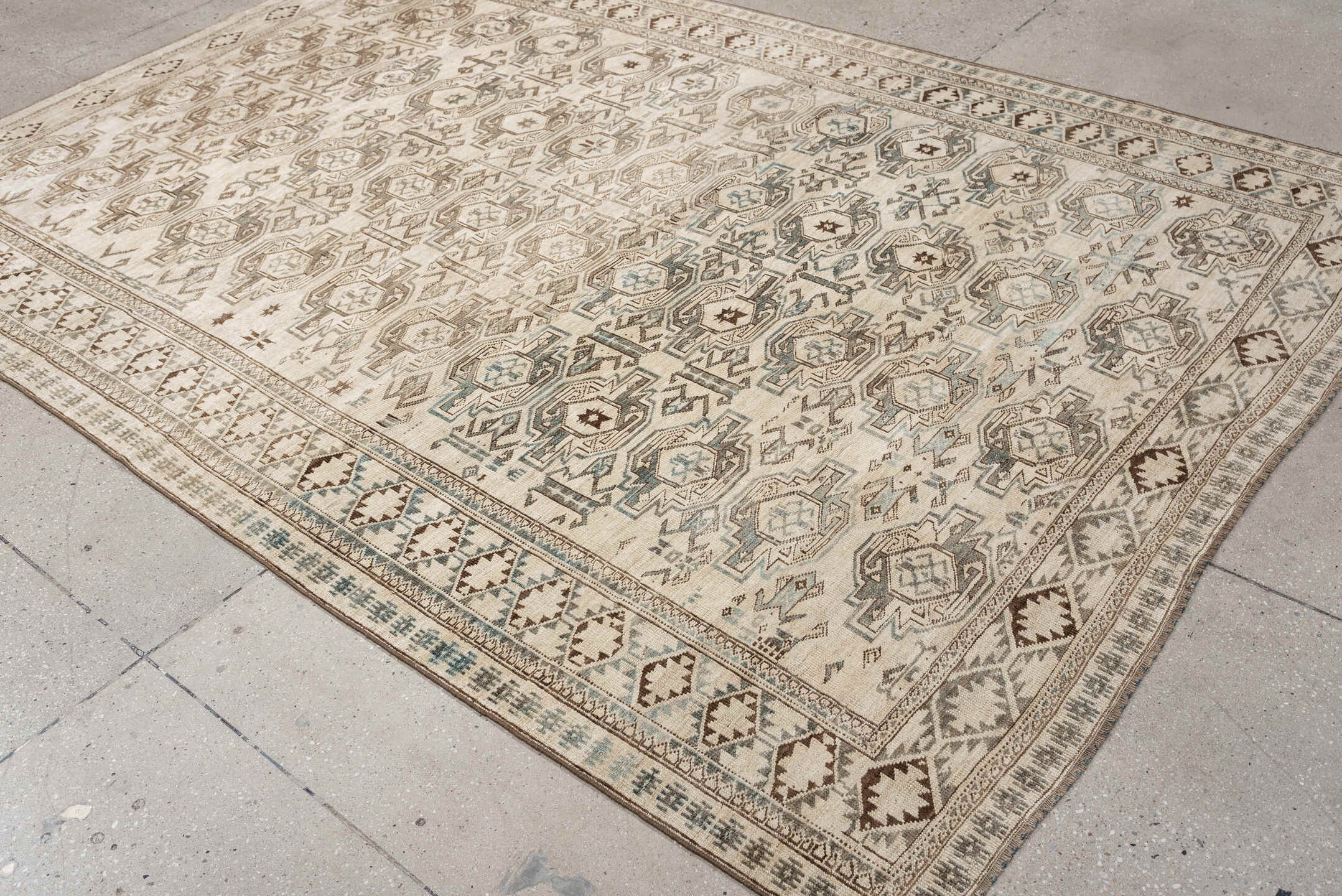 6' x 8' one-of-a-kind handmade vintage Belouch medium size rug. Color palette: ivory, taupe, brown, camel, pale blue, beige
