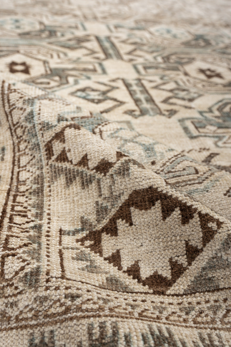 6' x 8' one-of-a-kind handmade vintage Belouch medium size rug. Color palette: ivory, taupe, brown, camel, pale blue, beige
