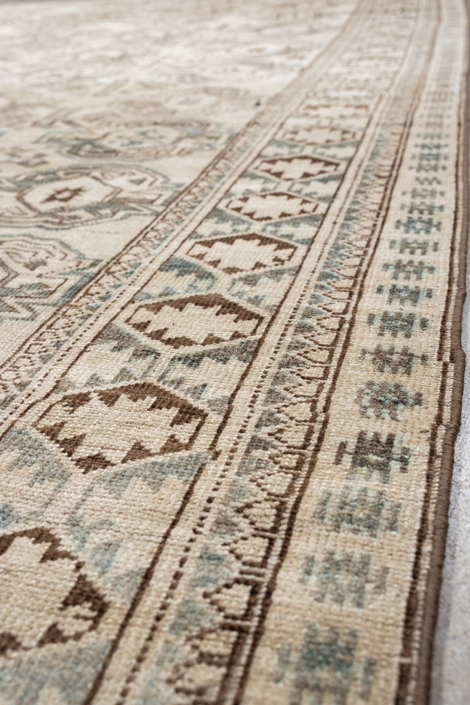 6' x 8' one-of-a-kind handmade vintage Belouch medium size rug. Color palette: ivory, taupe, brown, camel, pale blue, beige