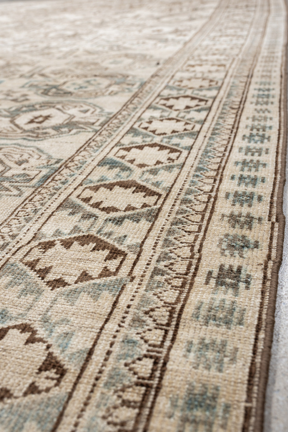 6' x 8' one-of-a-kind handmade vintage Belouch medium size rug. Color palette: ivory, taupe, brown, camel, pale blue, beige