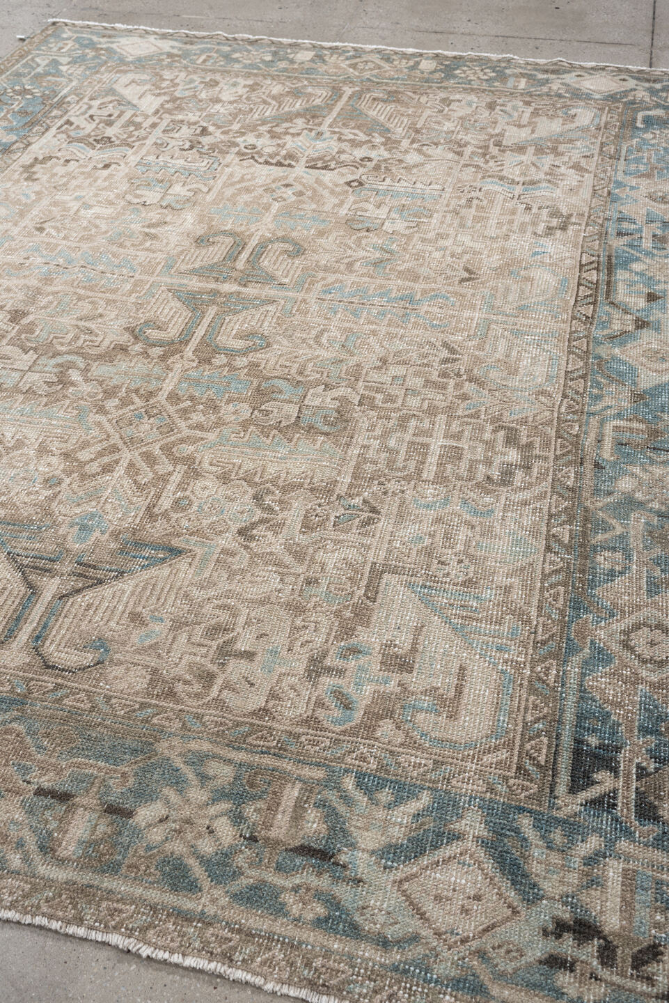 7' x 8' one-of-a-kind handmade vintage Heriz rug. Color palette: ivory, sky blue, taupe, charcoal, beige, brown, light blue