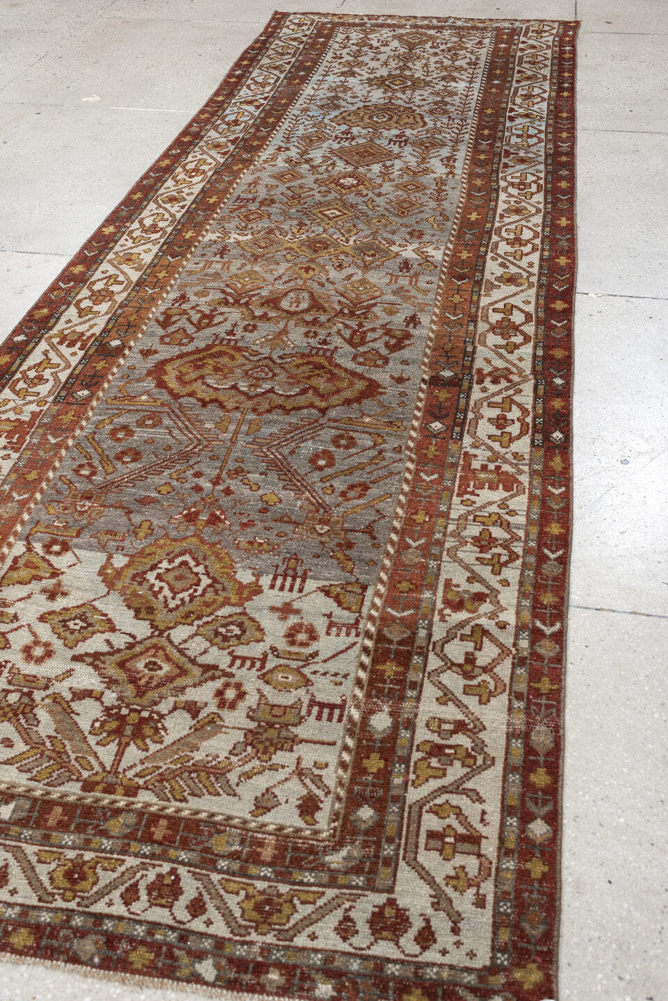 3' x 11' one-of-a-kind handmade antique Malayer runner rug. Color palette: ivory, rust, blue gray, terracotta, camel, brown