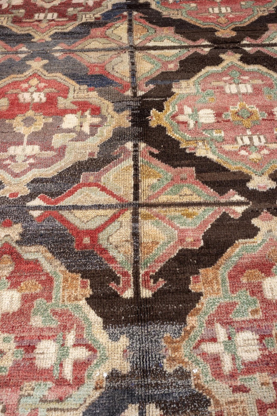 10' x 13' one-of-a-kind handmade vintage Kars oversize rug. Color palette: terracotta, charcoal, ivory, dusty rose