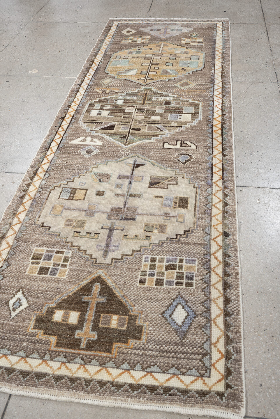 3' x 9' one-of-a-kind handmade vintage Kars runner rug. Color palette: taupe, ivory, charcoal, terracotta, blue gray, camel
