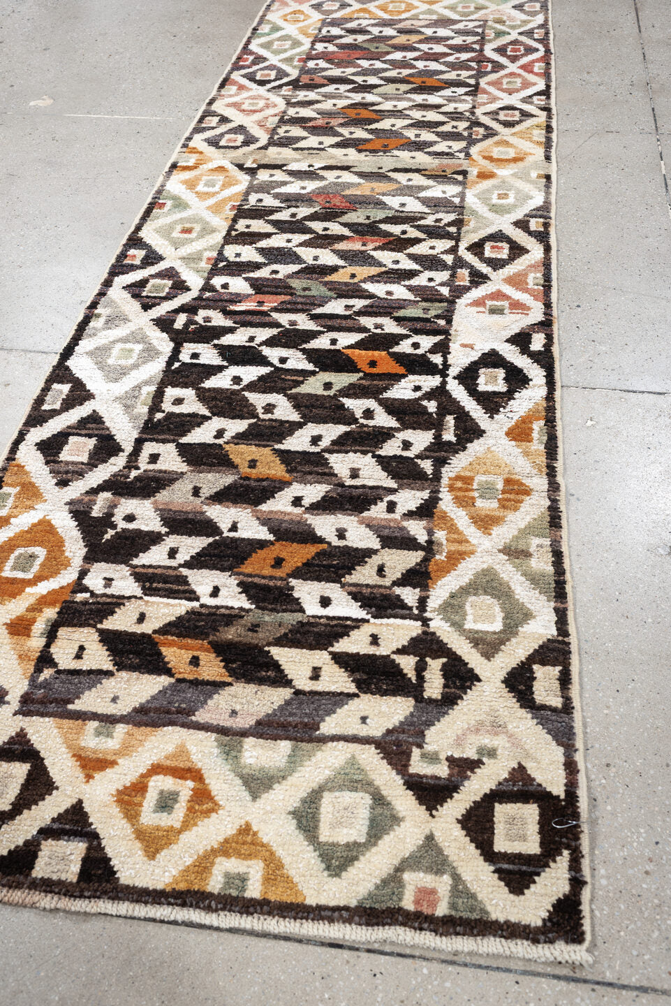 3' x 9' one-of-a-kind handmade vintage Kars runner rug. Color palette: dark brown, ivory, sage, rust, coral, taupe, charcoal