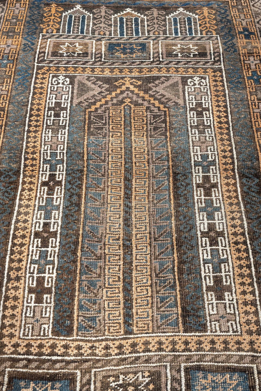 3' x 4' one-of-a-kind handmade antique Belouch small size rug. Color palette: brown, ivory, teal, peach, charcoal, taupe