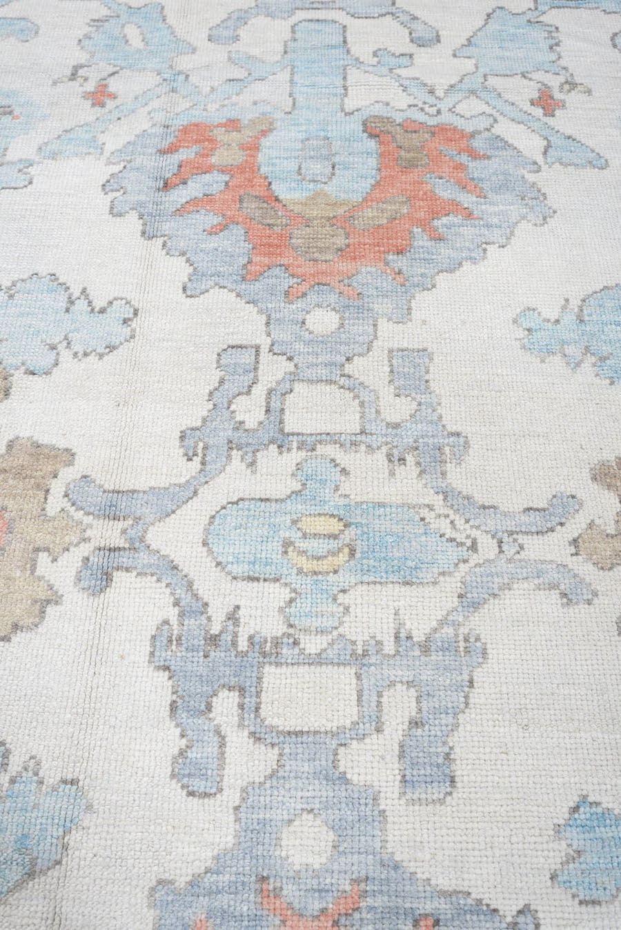 9' x 12' one-of-a-kind handmade vintage Oushak large size rug. Color palette: ivory, powder blue, taupe, coral, pale blue