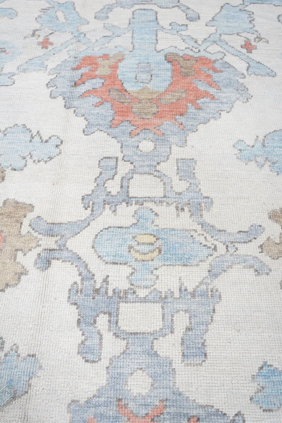 9' x 12' one-of-a-kind handmade vintage Oushak large size rug. Color palette: ivory, powder blue, taupe, coral, pale blue