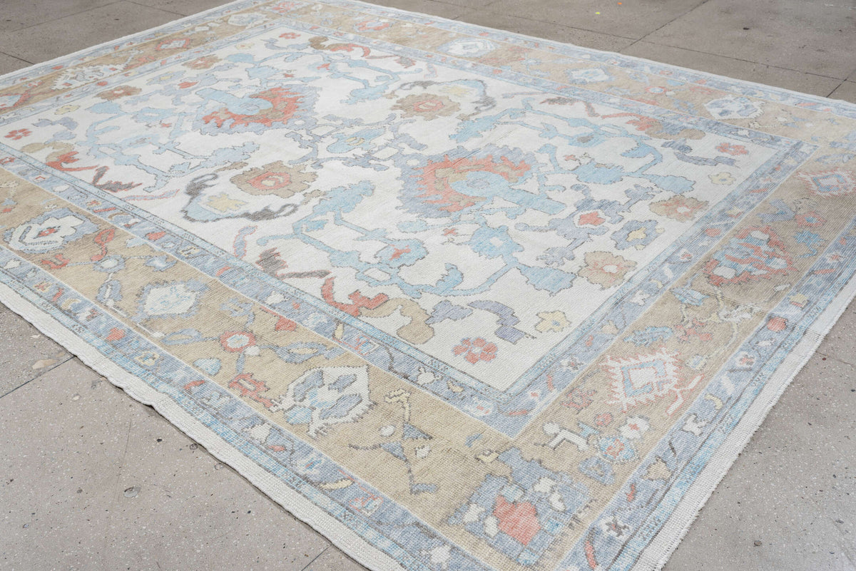 9' x 12' one-of-a-kind handmade vintage Oushak large size rug. Color palette: ivory, powder blue, taupe, coral, pale blue