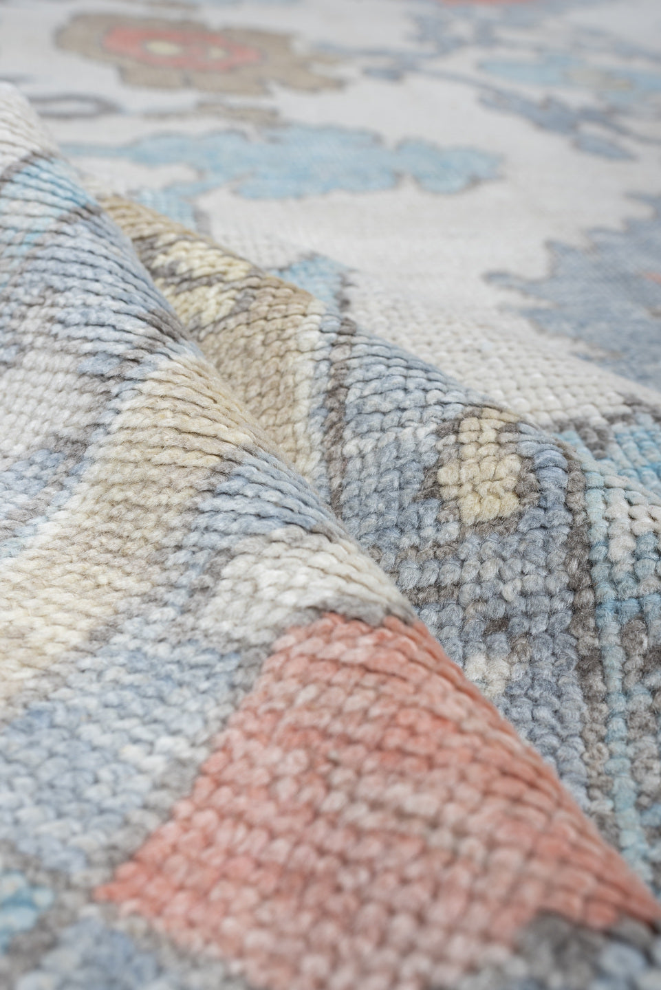 9' x 12' one-of-a-kind handmade vintage Oushak large size rug. Color palette: ivory, powder blue, taupe, coral, pale blue