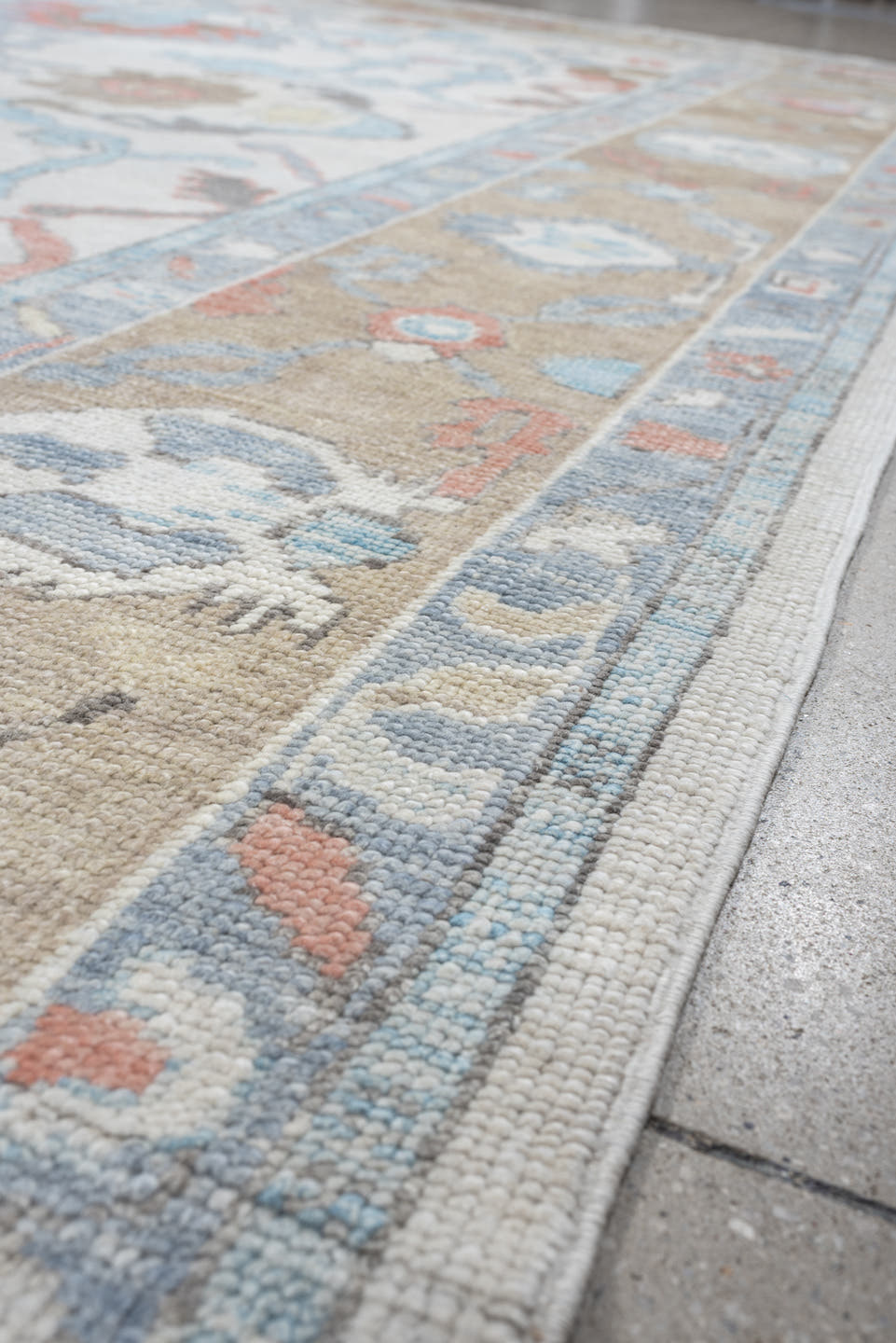 9' x 12' one-of-a-kind handmade vintage Oushak large size rug. Color palette: ivory, powder blue, taupe, coral, pale blue