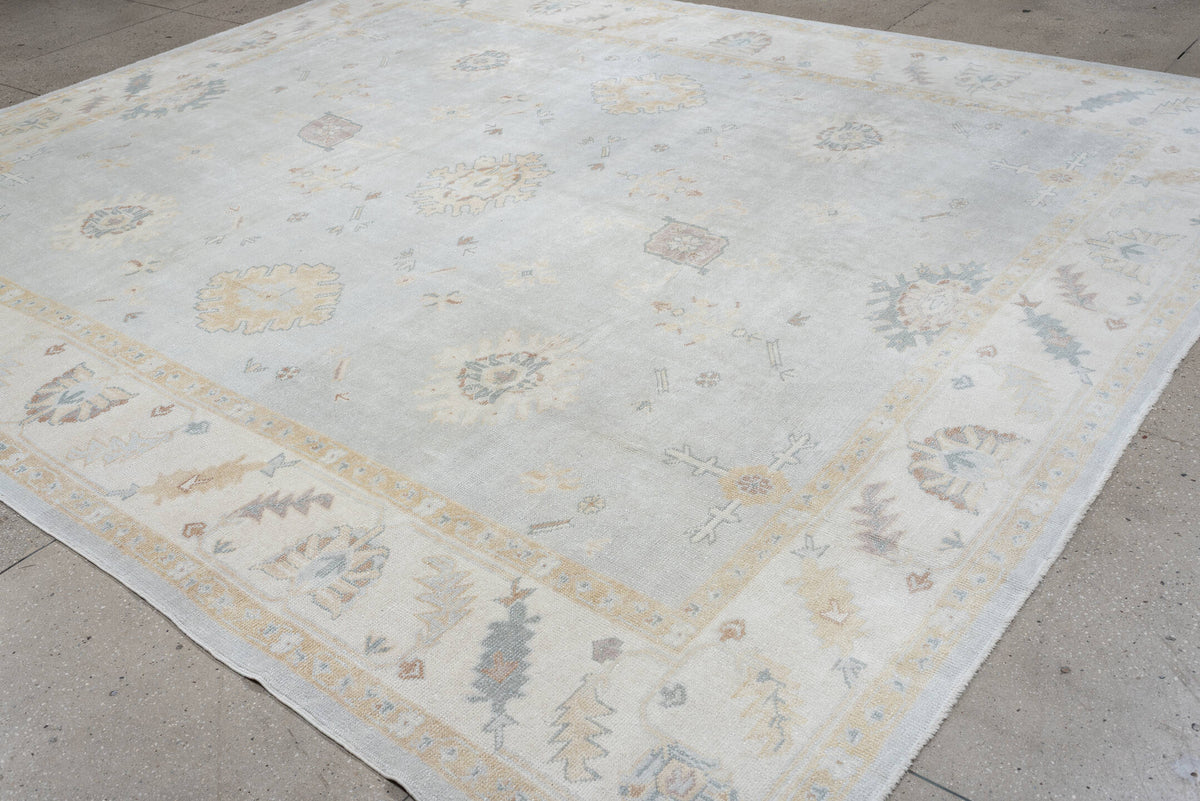 10' x 12' one-of-a-kind handmade vintage Oushak oversize rug. Color palette: blue gray, ivory, sage, dusty rose, terracotta
