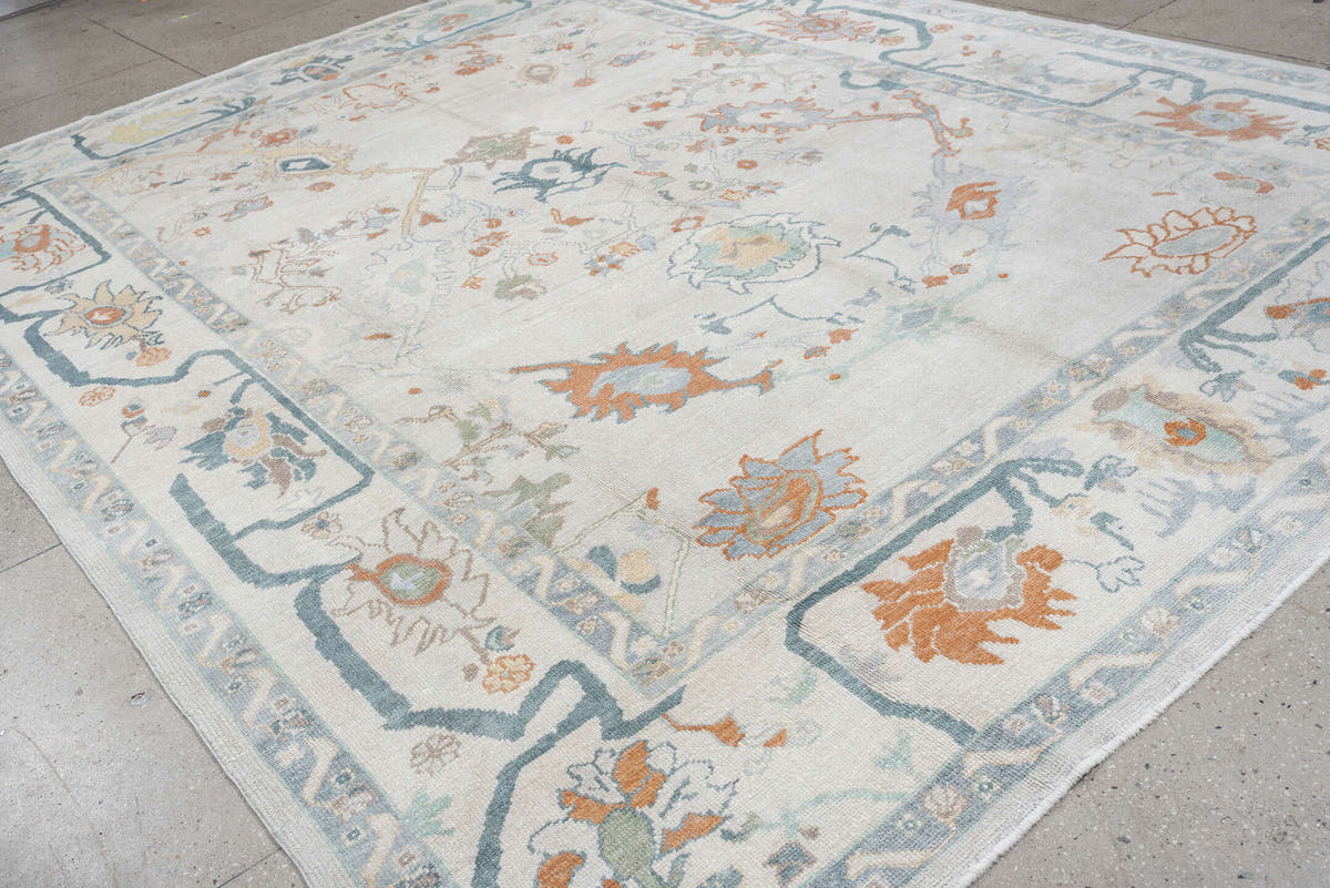 10' x 13' one-of-a-kind handmade vintage Oushak large size rug. Color palette: ivory, powder blue, sage, coral, peach, taupe