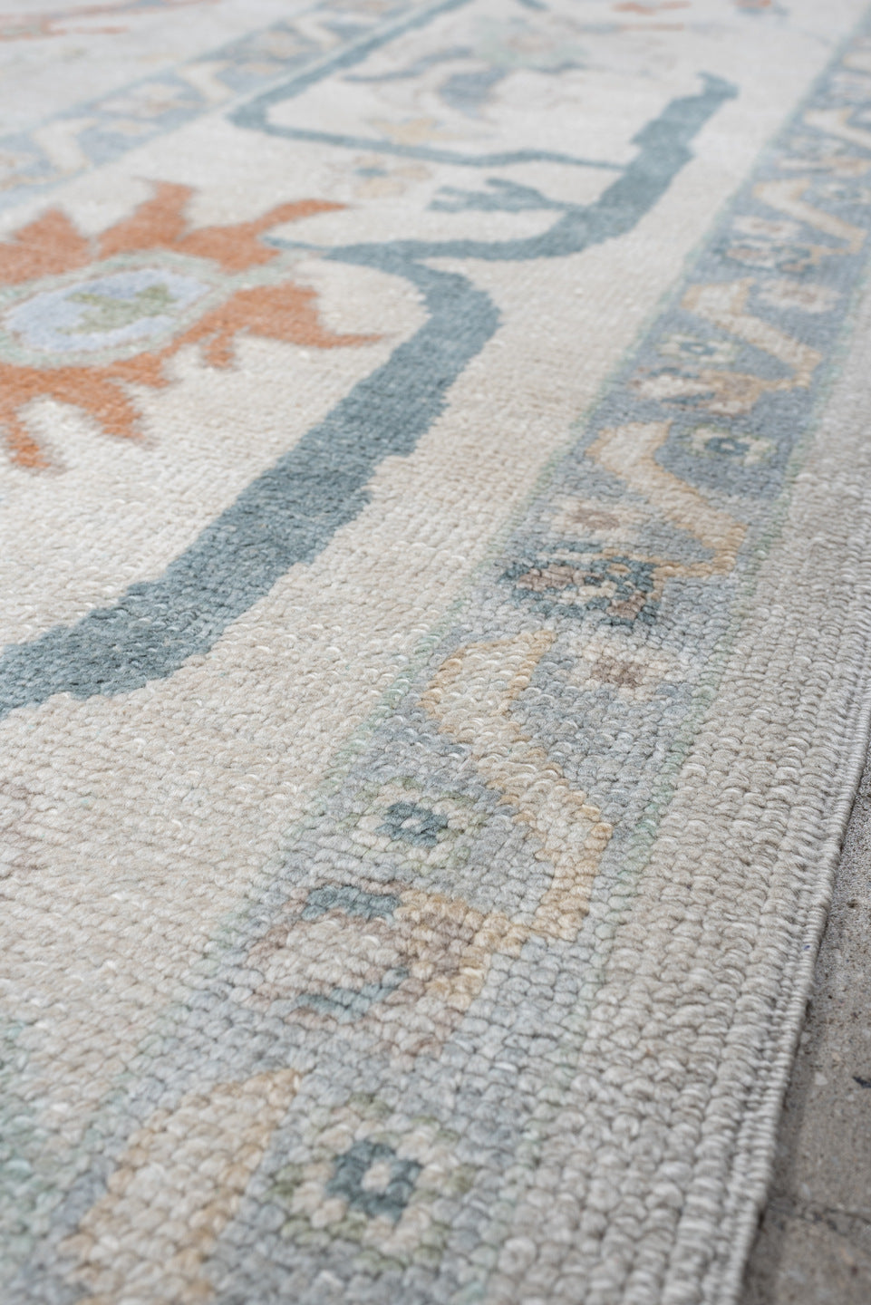 10' x 13' one-of-a-kind handmade vintage Oushak large size rug. Color palette: ivory, powder blue, sage, coral, peach, taupe