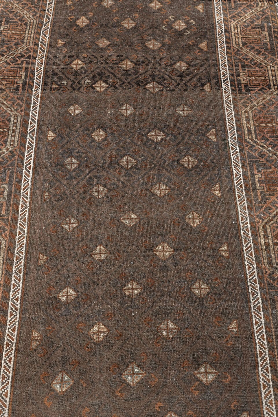 3' x 8' one-of-a-kind handmade antique Belouch runner rug. Color palette: brown, rust, ivory, charcoal, taupe, terracotta