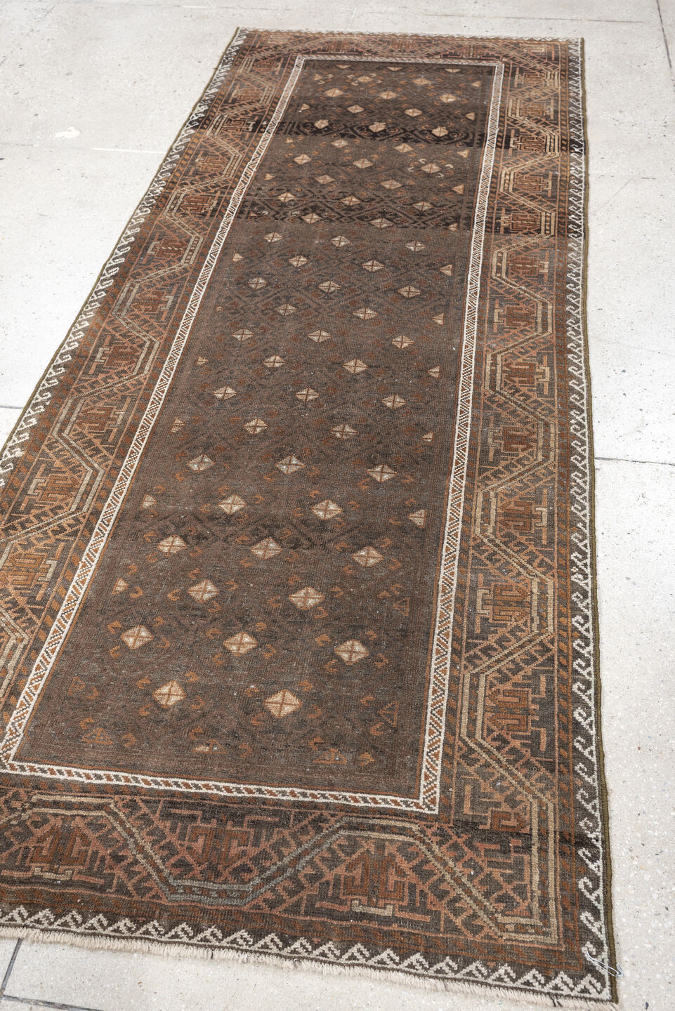 3' x 8' one-of-a-kind handmade antique Belouch runner rug. Color palette: brown, rust, ivory, charcoal, taupe, terracotta