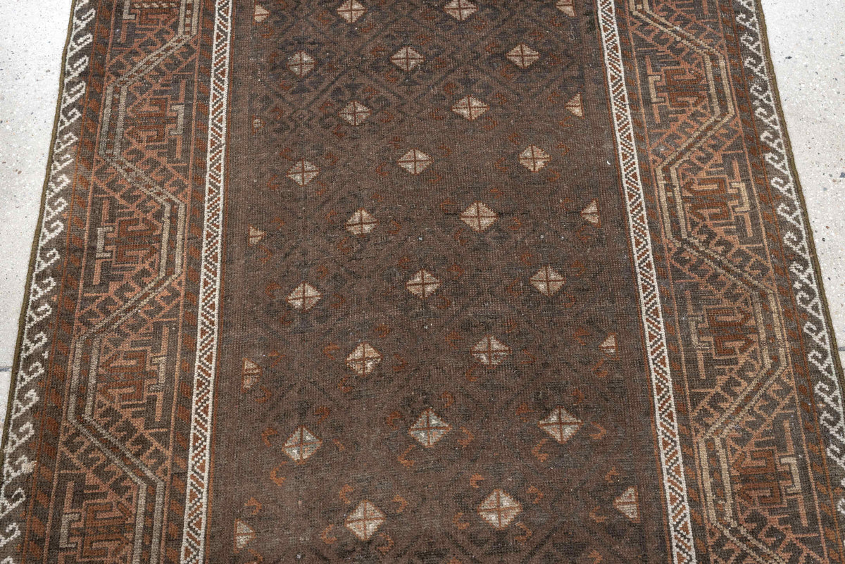 3' x 8' one-of-a-kind handmade antique Belouch runner rug. Color palette: brown, rust, ivory, charcoal, taupe, terracotta