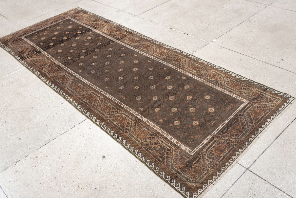 3' x 8' one-of-a-kind handmade antique Belouch runner rug. Color palette: brown, rust, ivory, charcoal, taupe, terracotta