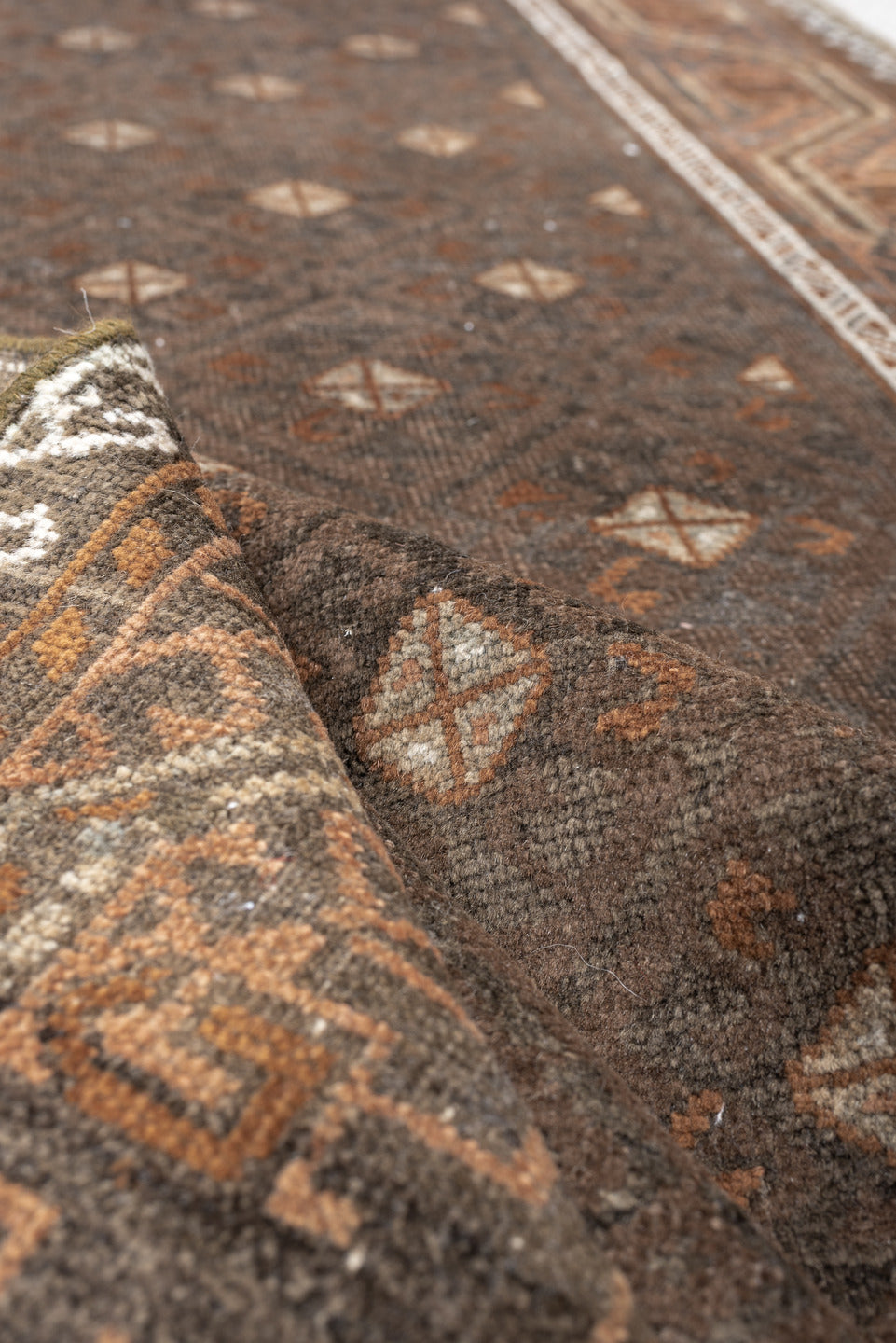 3' x 8' one-of-a-kind handmade antique Belouch runner rug. Color palette: brown, rust, ivory, charcoal, taupe, terracotta