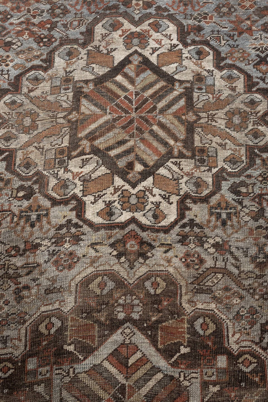 6' x 9' one-of-a-kind handmade antique Shiraz large size rug. Color palette: taupe, rust, ivory, dark brown, charcoal