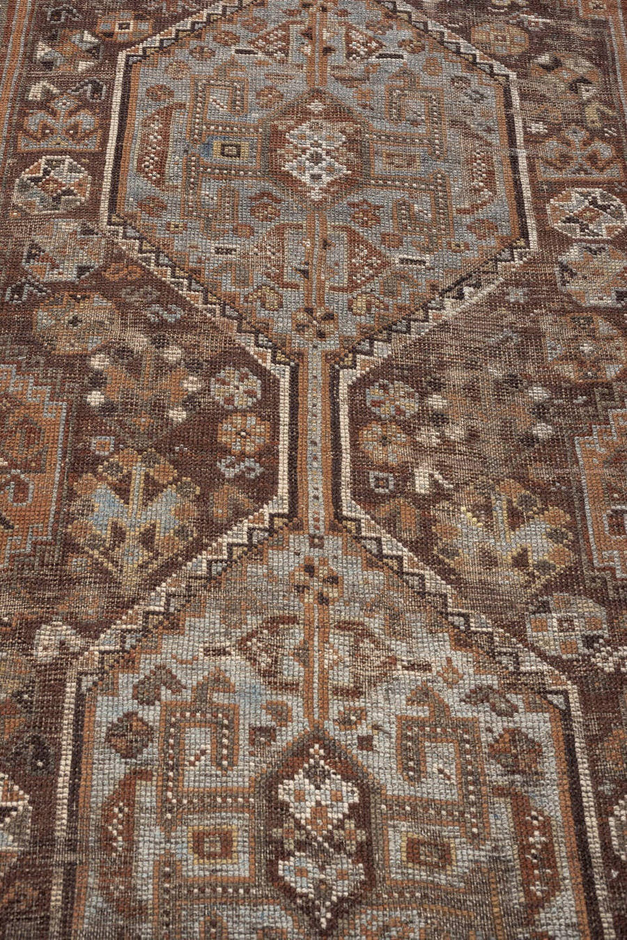 3' x 9' one-of-a-kind handmade antique Shiraz runner rug. Color palette: brown, rust, ivory, camel, slate, charcoal