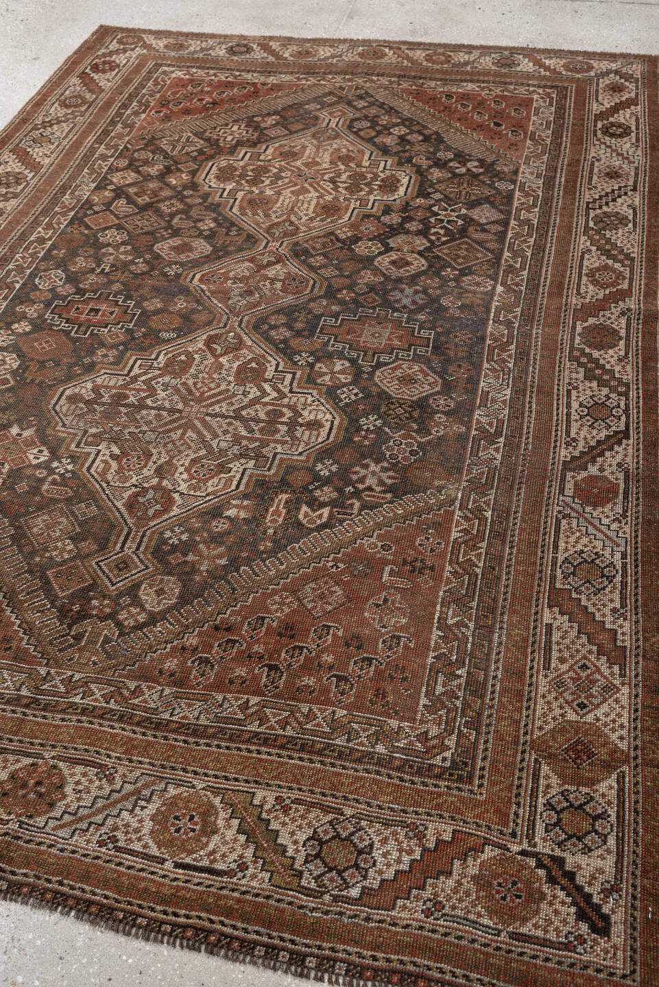 4' x 6' one-of-a-kind handmade antique Shiraz rug. Color palette: brown, rust, ivory, terracotta, charcoal, camel, sage