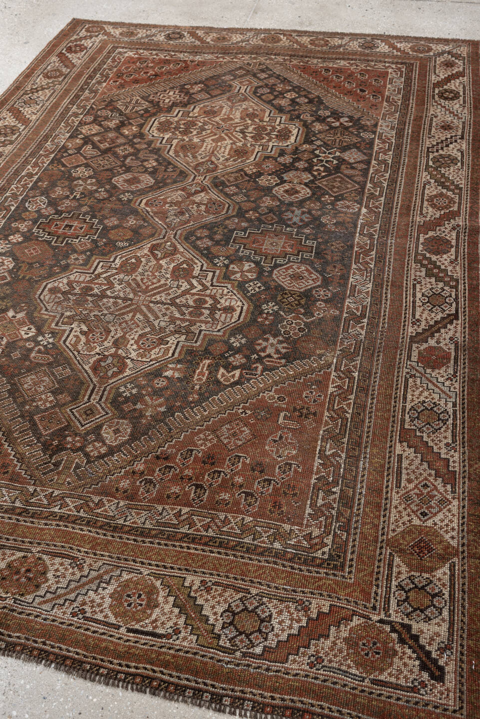 4' x 6' one-of-a-kind handmade antique Shiraz rug. Color palette: brown, rust, ivory, terracotta, charcoal, camel, sage
