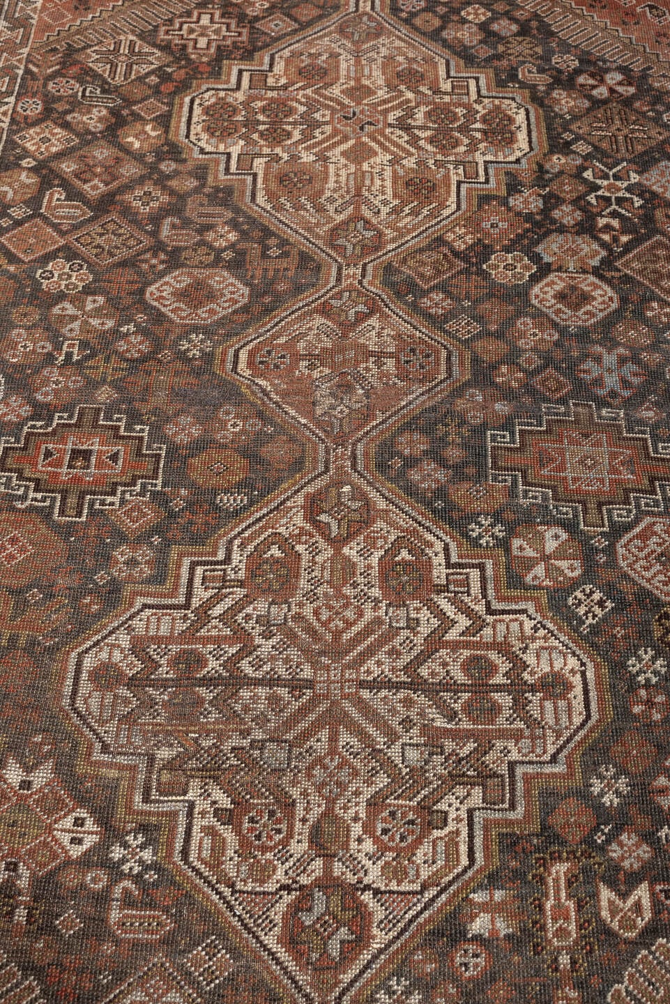 4' x 6' one-of-a-kind handmade antique Shiraz rug. Color palette: brown, rust, ivory, terracotta, charcoal, camel, sage