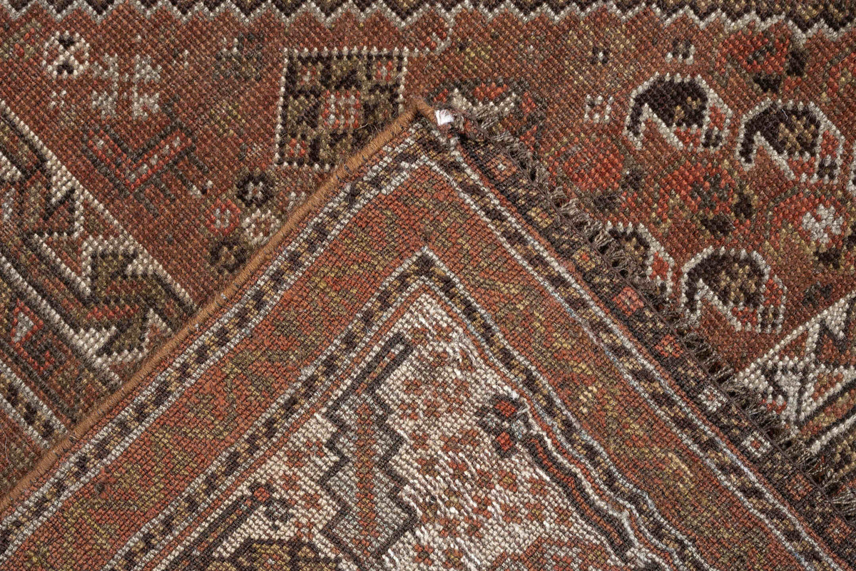 4' x 6' one-of-a-kind handmade antique Shiraz rug. Color palette: brown, rust, ivory, terracotta, charcoal, camel, sage