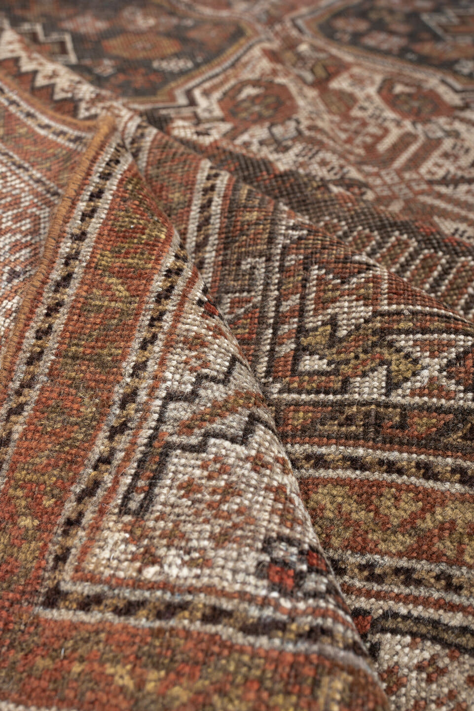 4' x 6' one-of-a-kind handmade antique Shiraz rug. Color palette: brown, rust, ivory, terracotta, charcoal, camel, sage