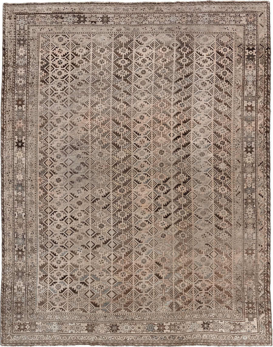 7' x 9' one-of-a-kind handmade antique Shiraz rug. Color palette: taupe, ivory, charcoal, brown, gray, cream, ebony, beige