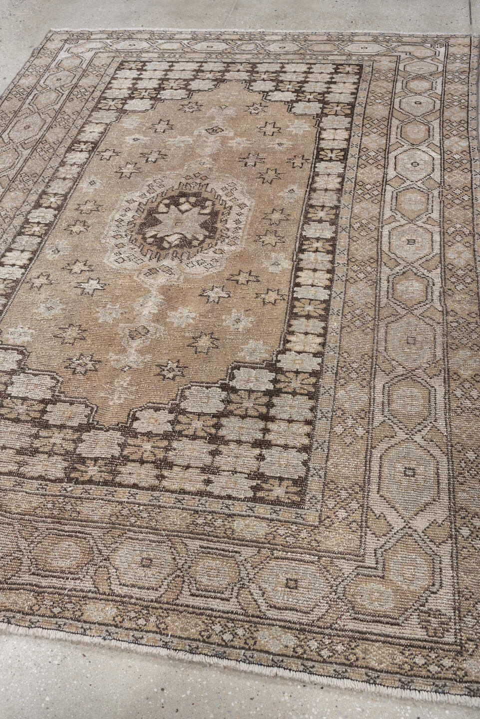 5' x 7' one-of-a-kind handmade antique Kurd rug. Color palette: taupe, ivory, charcoal, camel, beige, brown, gray, black