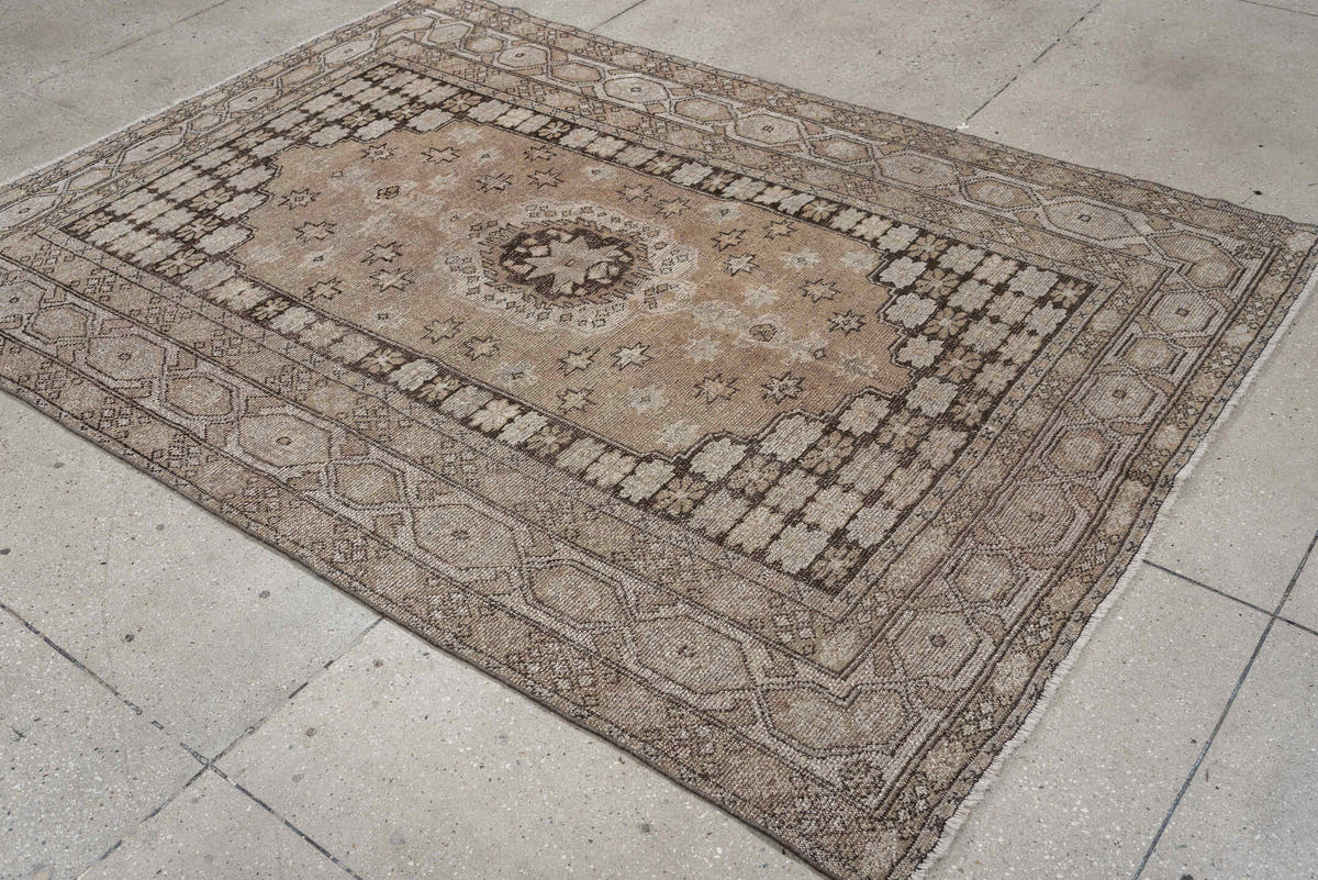 5' x 7' one-of-a-kind handmade antique Kurd rug. Color palette: taupe, ivory, charcoal, camel, beige, brown, gray, black