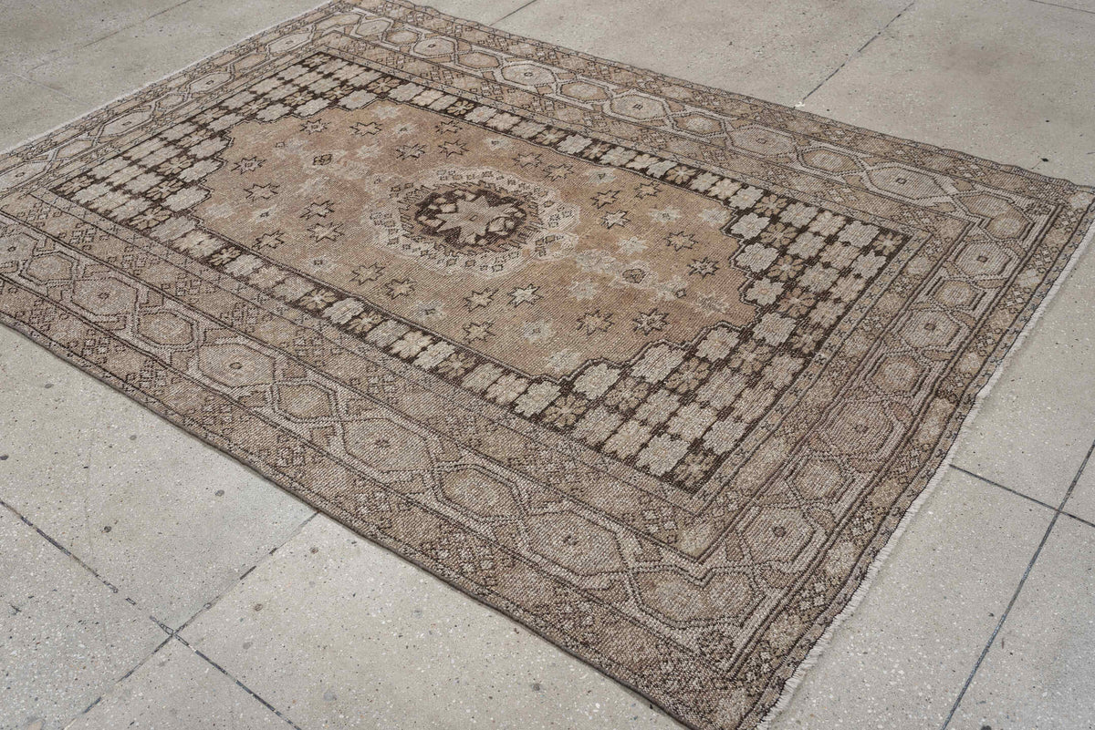 5' x 7' one-of-a-kind handmade antique Kurd rug. Color palette: taupe, ivory, charcoal, camel, beige, brown, gray, black