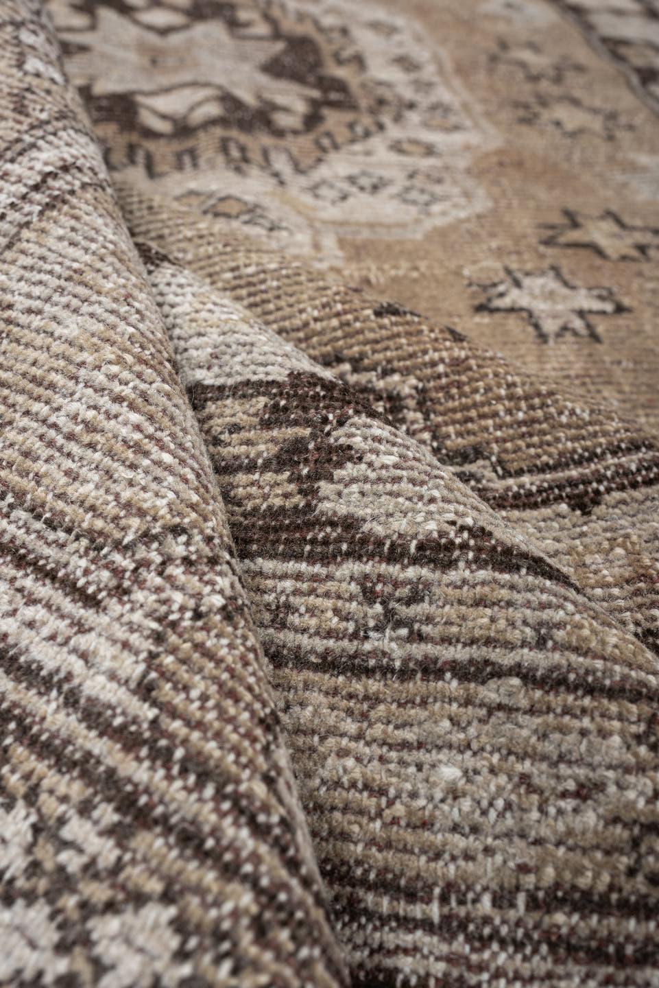5' x 7' one-of-a-kind handmade antique Kurd rug. Color palette: taupe, ivory, charcoal, camel, beige, brown, gray, black