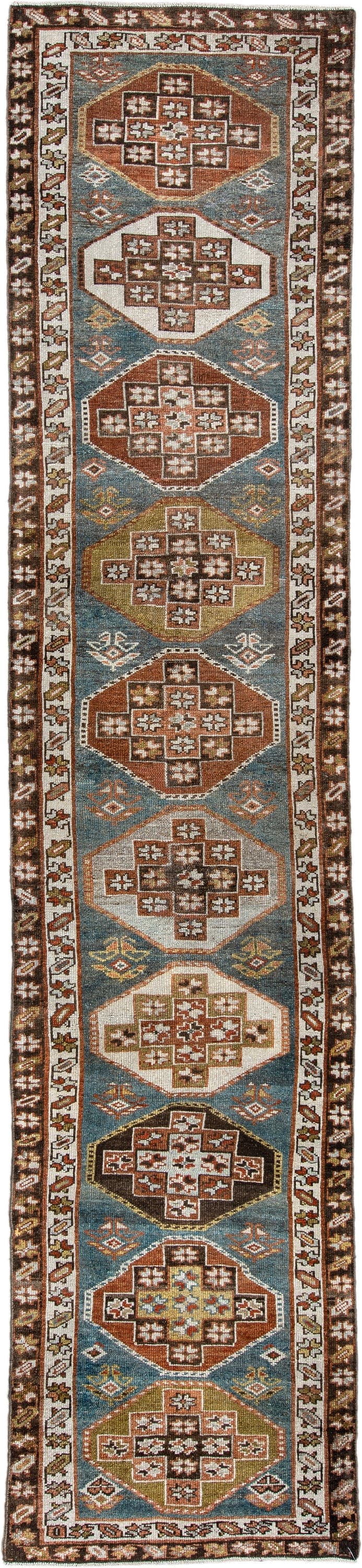 2' x 12' one-of-a-kind handmade antique Kurd runner rug. Color palette: blue green, rust, ivory, dark brown, ochre, olive