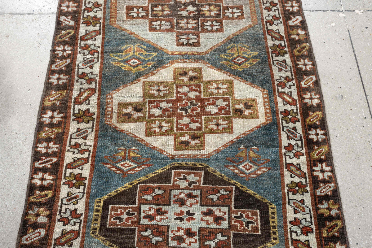 2' x 12' one-of-a-kind handmade antique Kurd runner rug. Color palette: blue green, rust, ivory, dark brown, ochre, olive