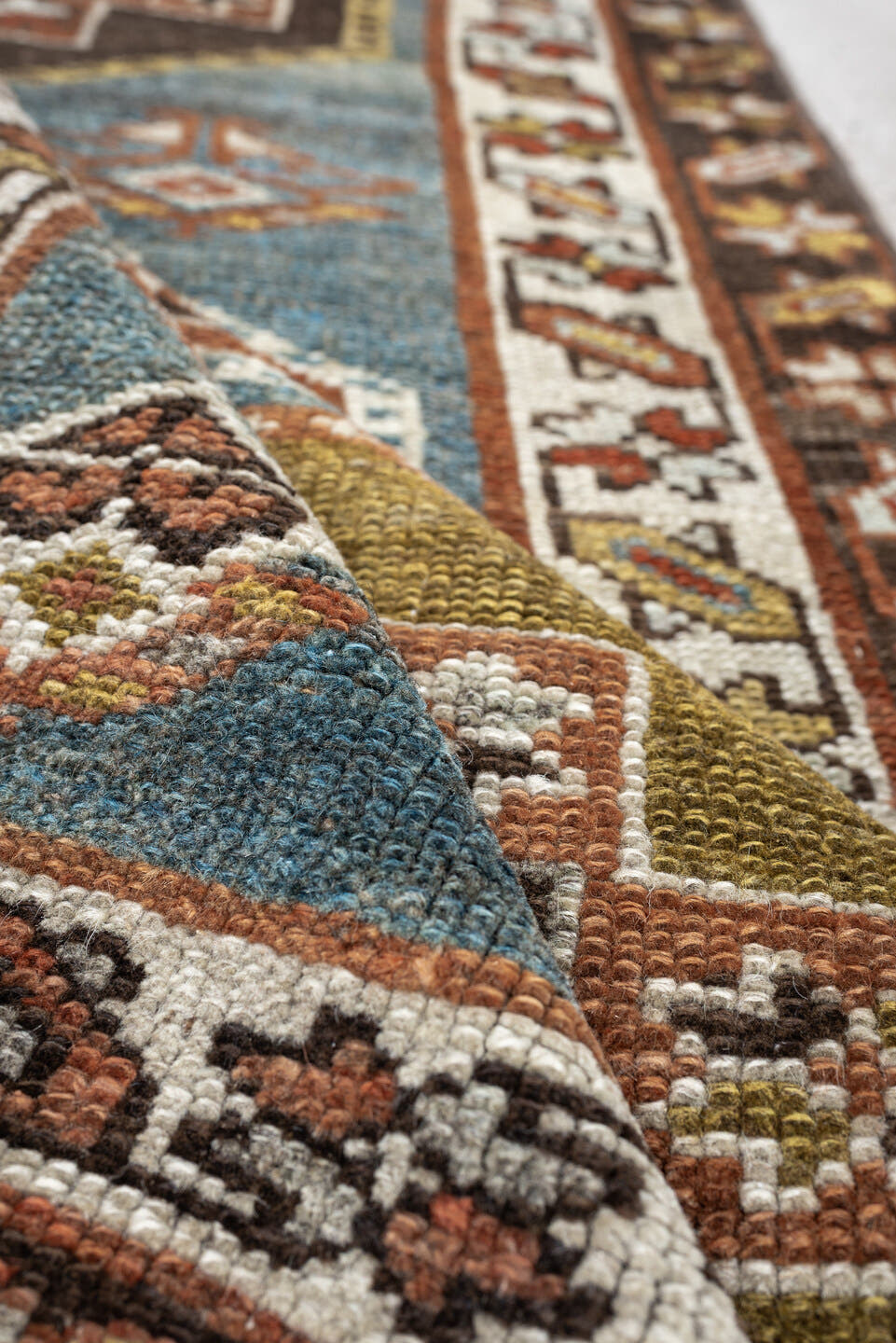 2' x 12' one-of-a-kind handmade antique Kurd runner rug. Color palette: blue green, rust, ivory, dark brown, ochre, olive