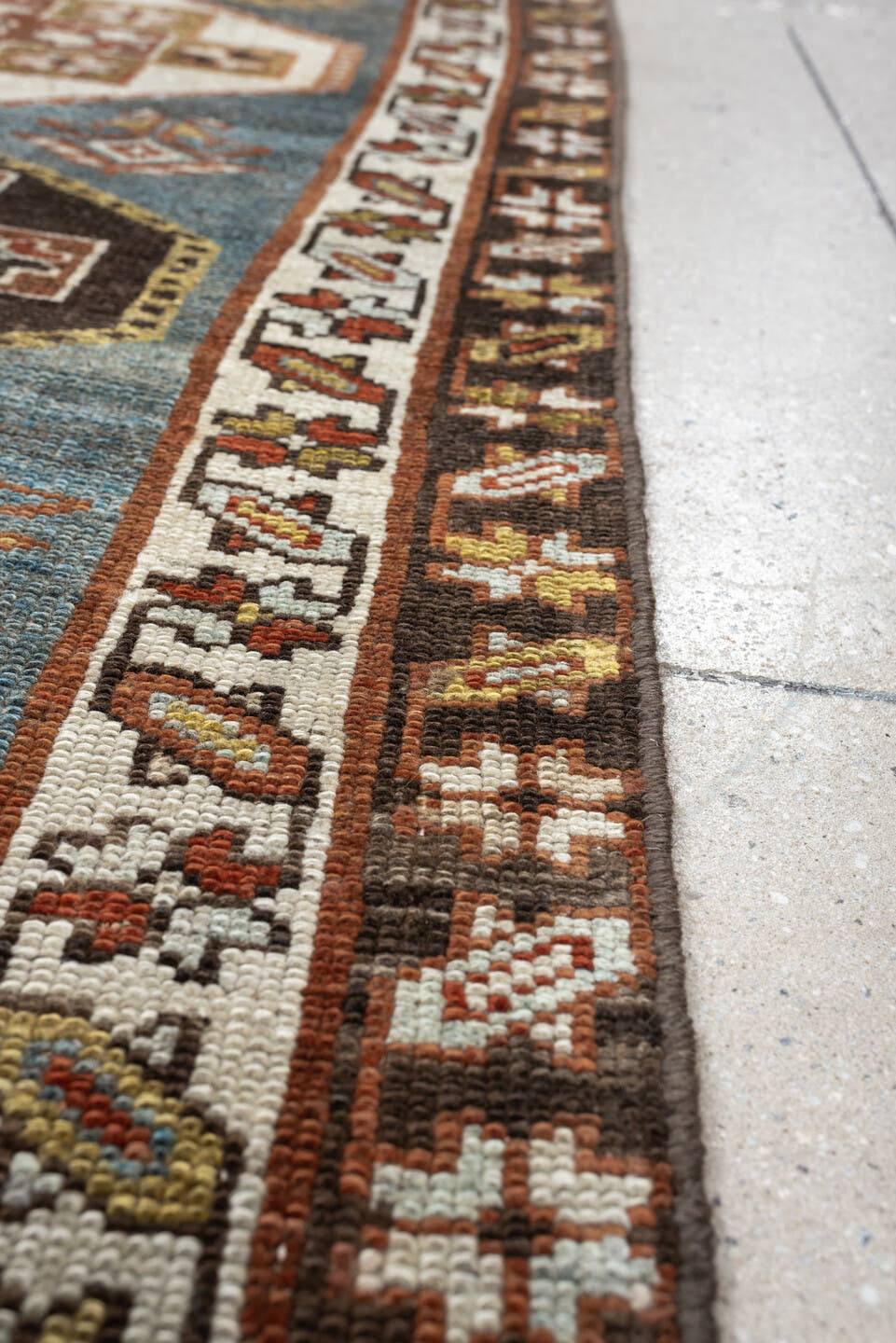 2' x 12' one-of-a-kind handmade antique Kurd runner rug. Color palette: blue green, rust, ivory, dark brown, ochre, olive