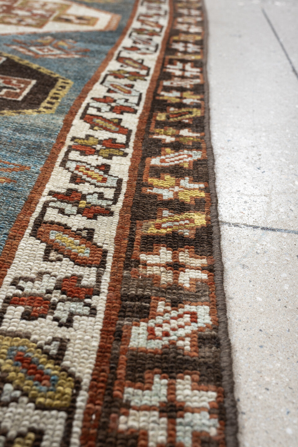 2' x 12' one-of-a-kind handmade antique Kurd runner rug. Color palette: blue green, rust, ivory, dark brown, ochre, olive