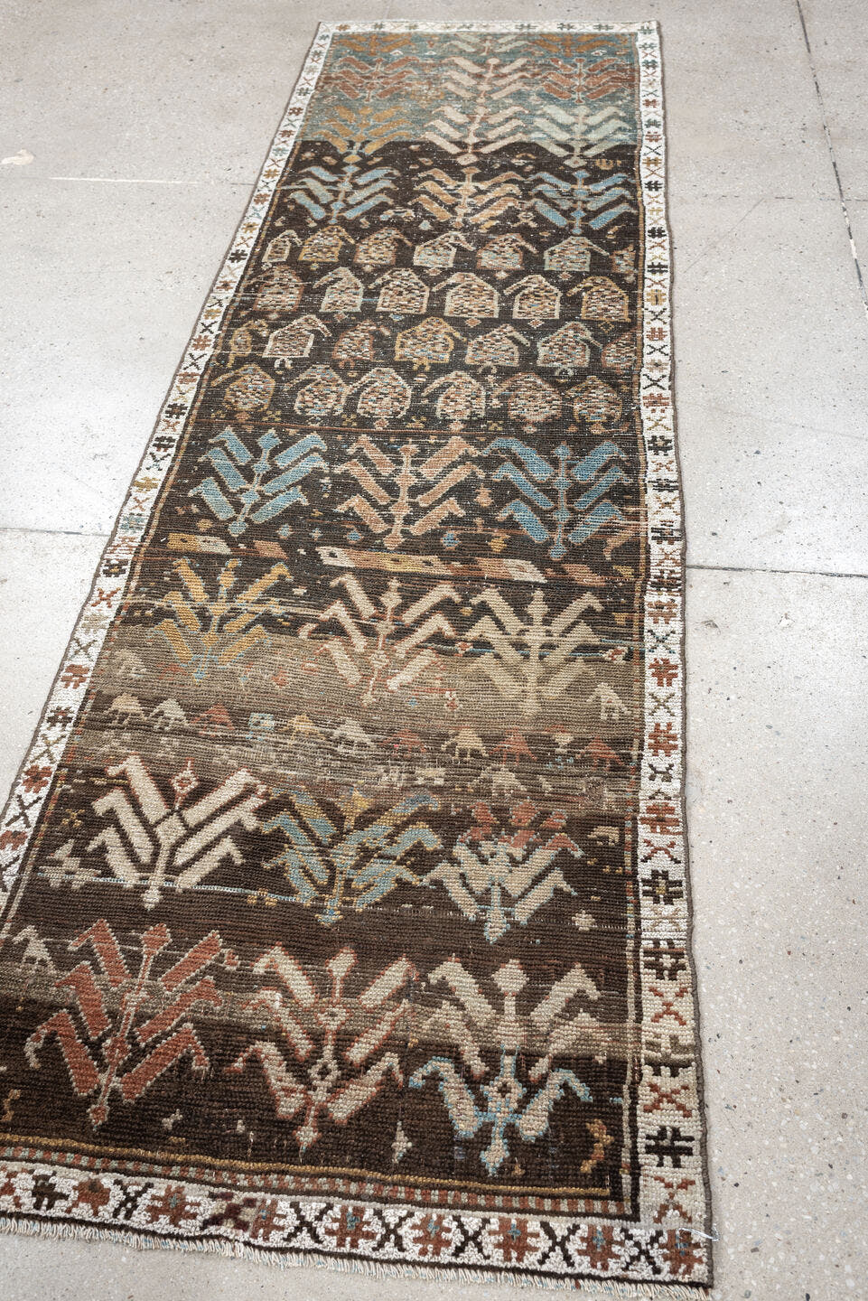 2' x 8' one-of-a-kind handmade antique Kurd runner rug. Color palette: charcoal, ivory, blue gray, taupe, terracotta, brown