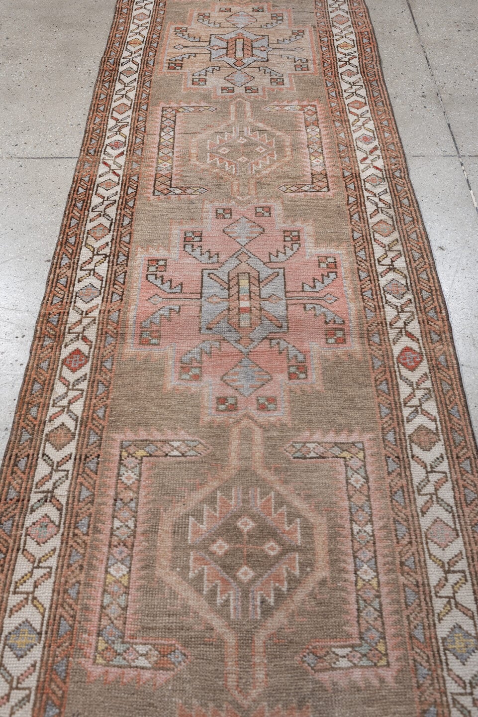 2' x 13' one-of-a-kind handmade antique Kurd runner rug. Color palette: taupe, ivory, terra cotta, charcoal, blue gray, rose